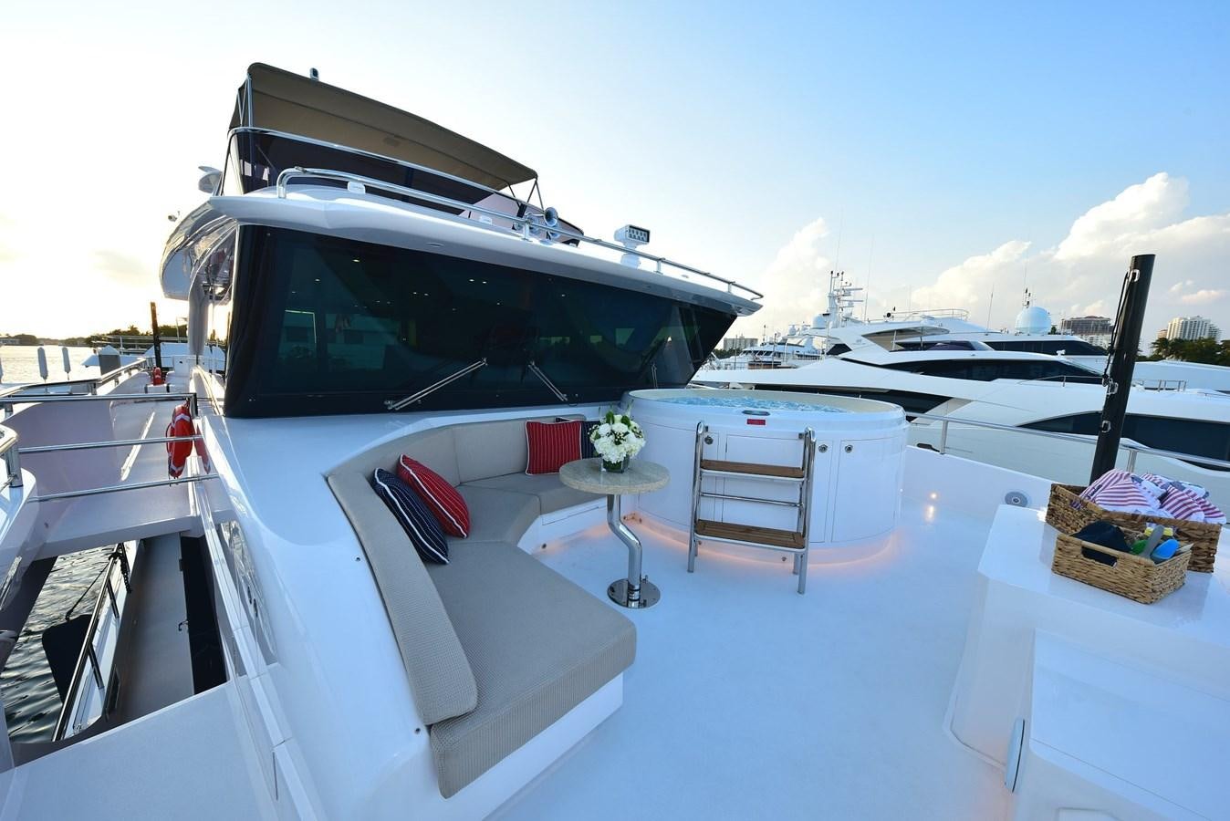 a white boat with a black roof aboard FREEDOM Yacht for Sale