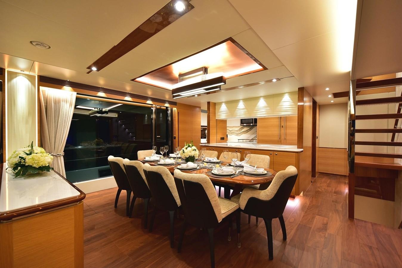 a dining room with a table and chairs aboard FREEDOM Yacht for Sale