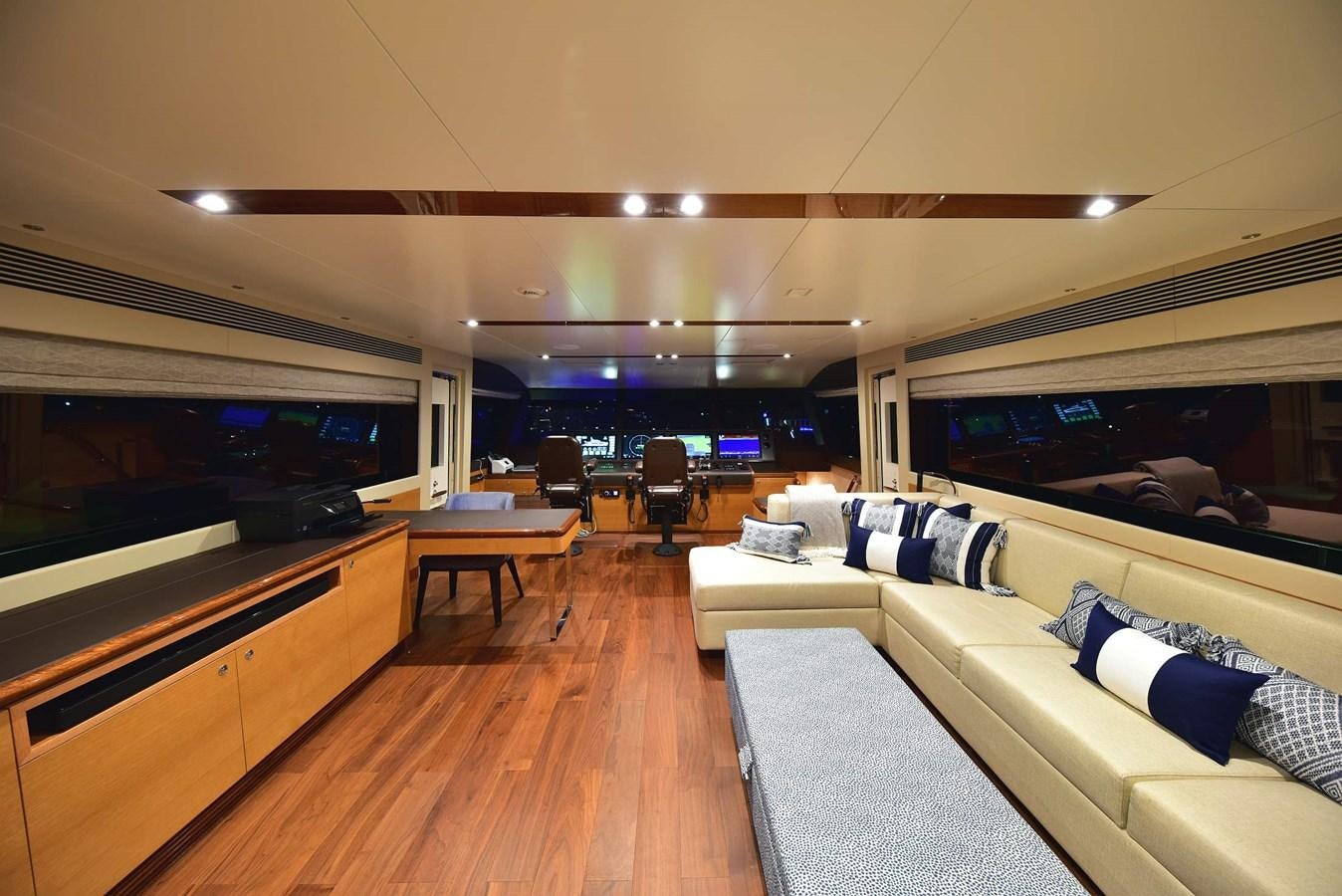 a living room with a large window aboard FREEDOM Yacht for Sale