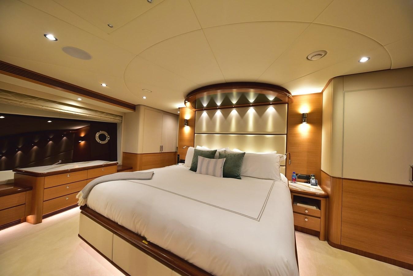 a room with a bed and a television aboard FREEDOM Yacht for Sale