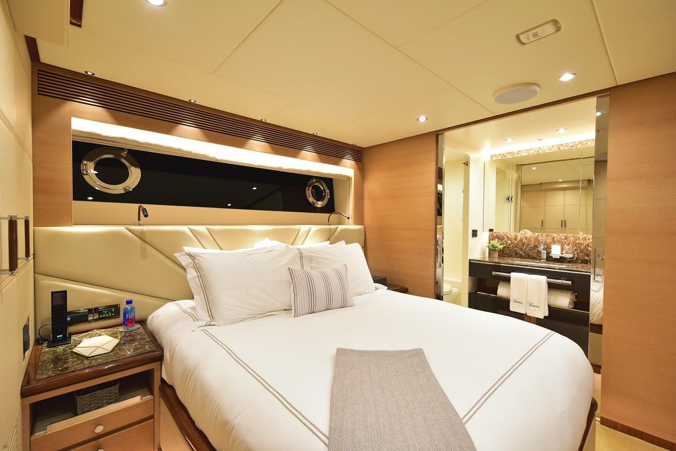 a hotel room with a bed aboard FREEDOM Yacht for Sale