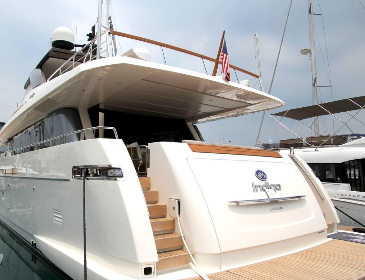 a boat with a flag on the front aboard INDIGO Yacht for Sale