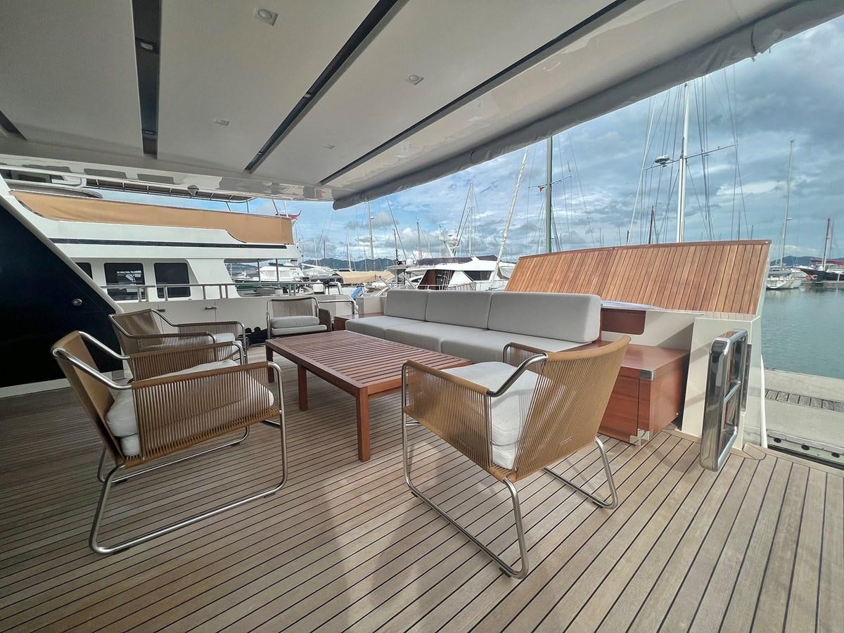 a room with a table chairs and a large window aboard INDIGO Yacht for Sale