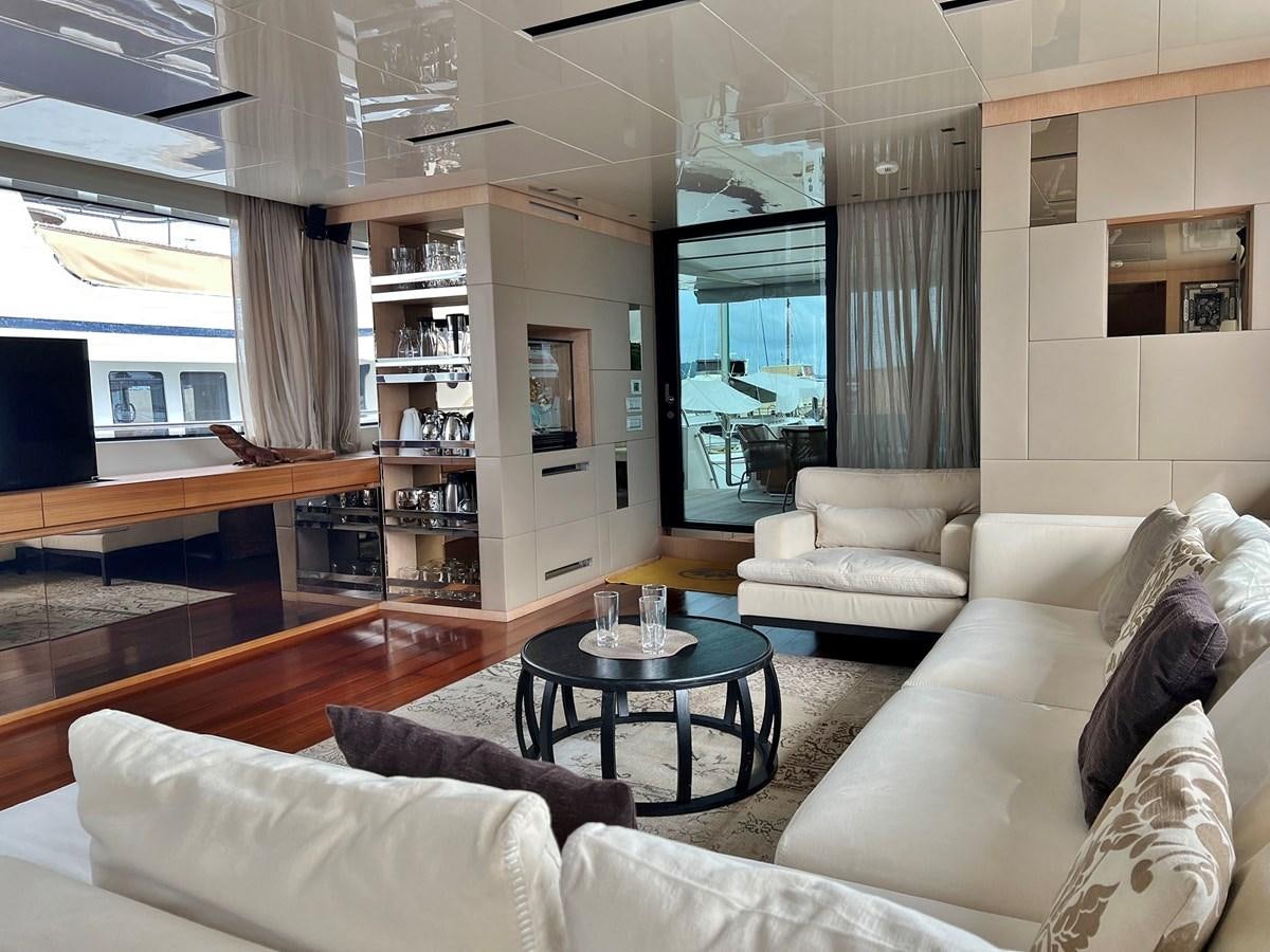 a living room with a large window aboard INDIGO Yacht for Sale