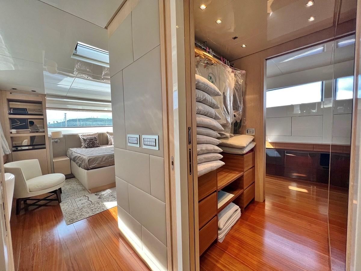 a room with a wood floor and a wood cabinet with a wood floor aboard INDIGO Yacht for Sale