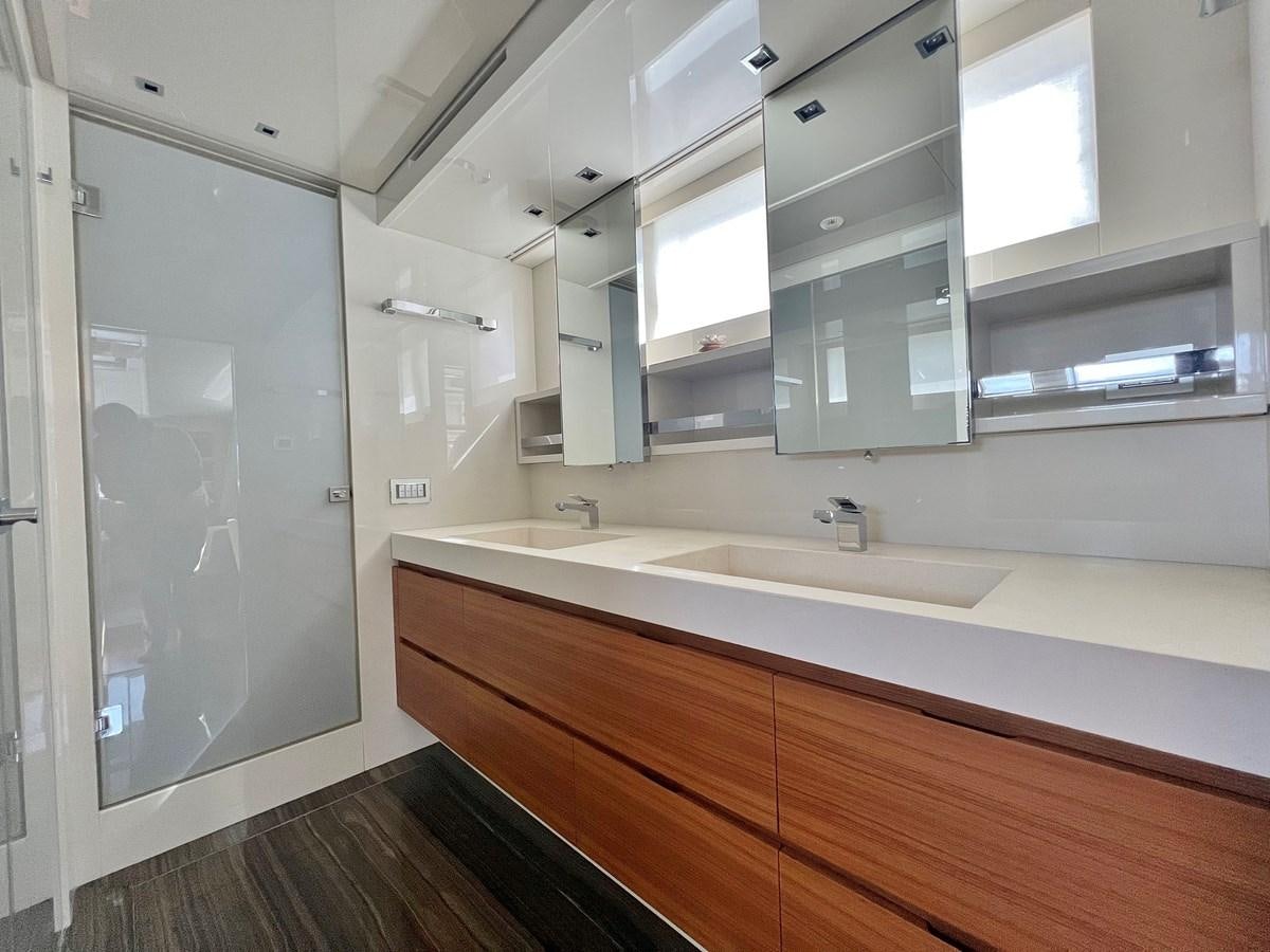 a bathroom with a shower unit and sink aboard INDIGO Yacht for Sale