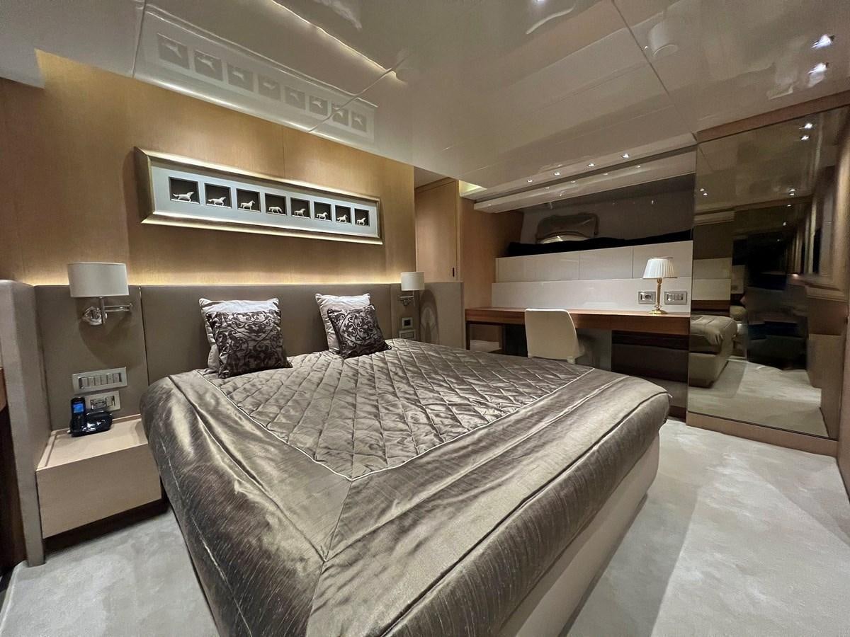 a bed in a hotel room aboard INDIGO Yacht for Sale