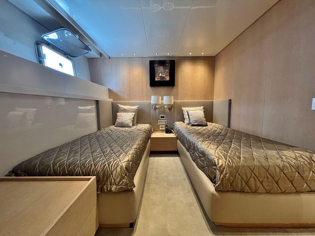 a room with two beds aboard INDIGO Yacht for Sale