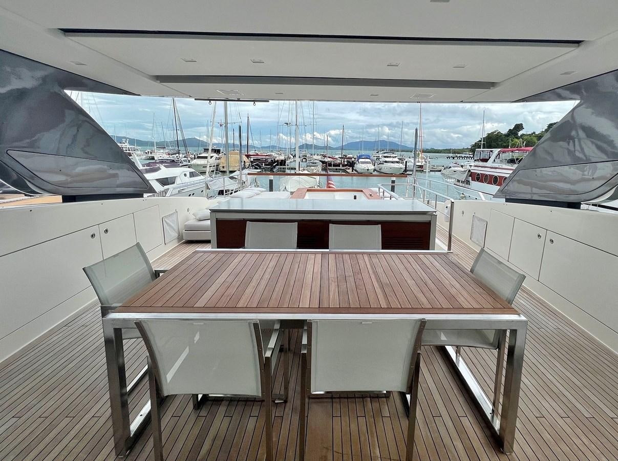 a table on a deck aboard INDIGO Yacht for Sale