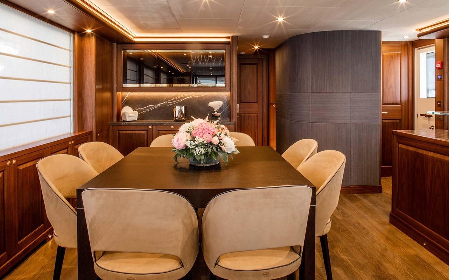 a dining table in a kitchen aboard ATLAS Yacht for Sale