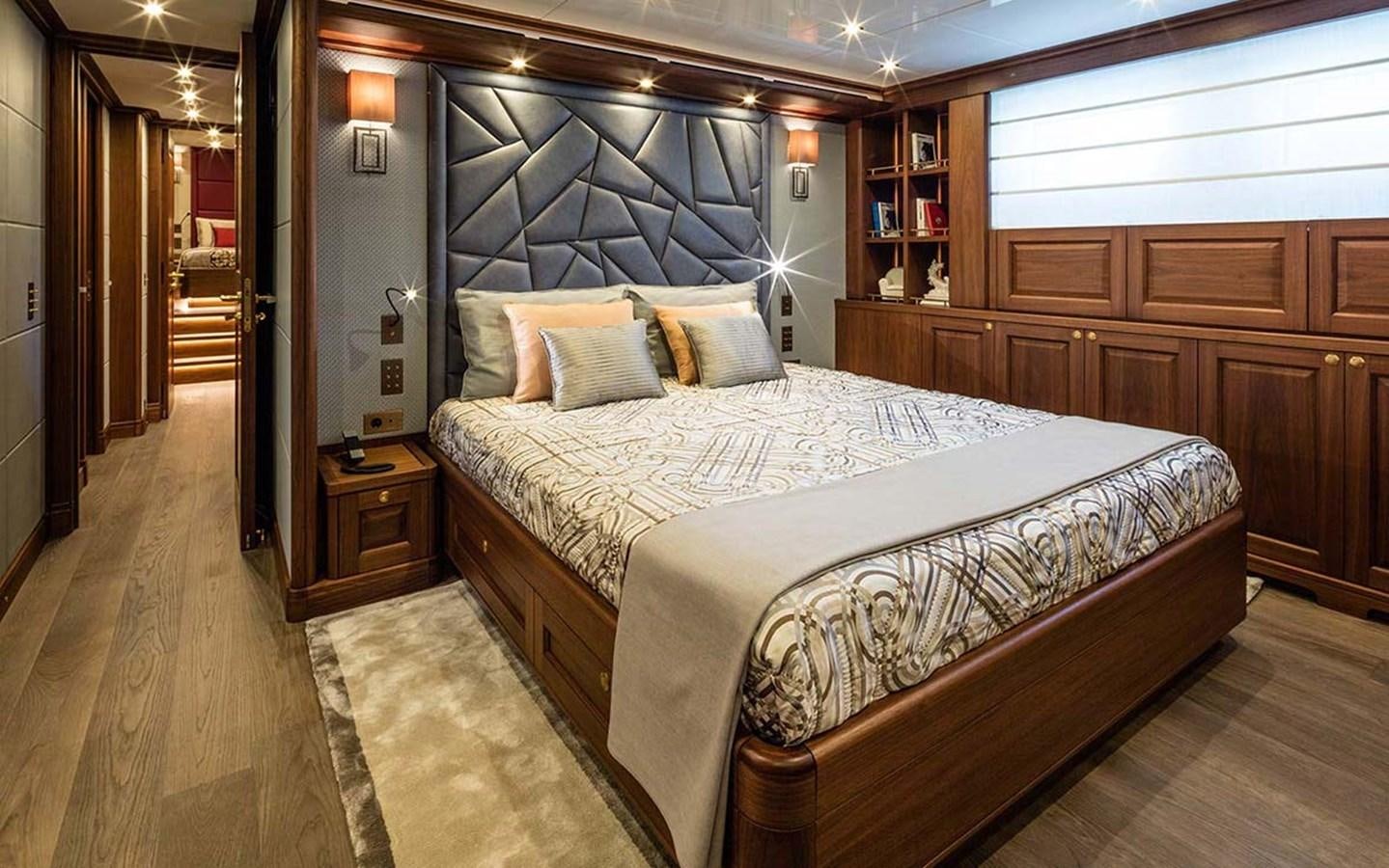 a large bed in a room aboard ATLAS Yacht for Sale