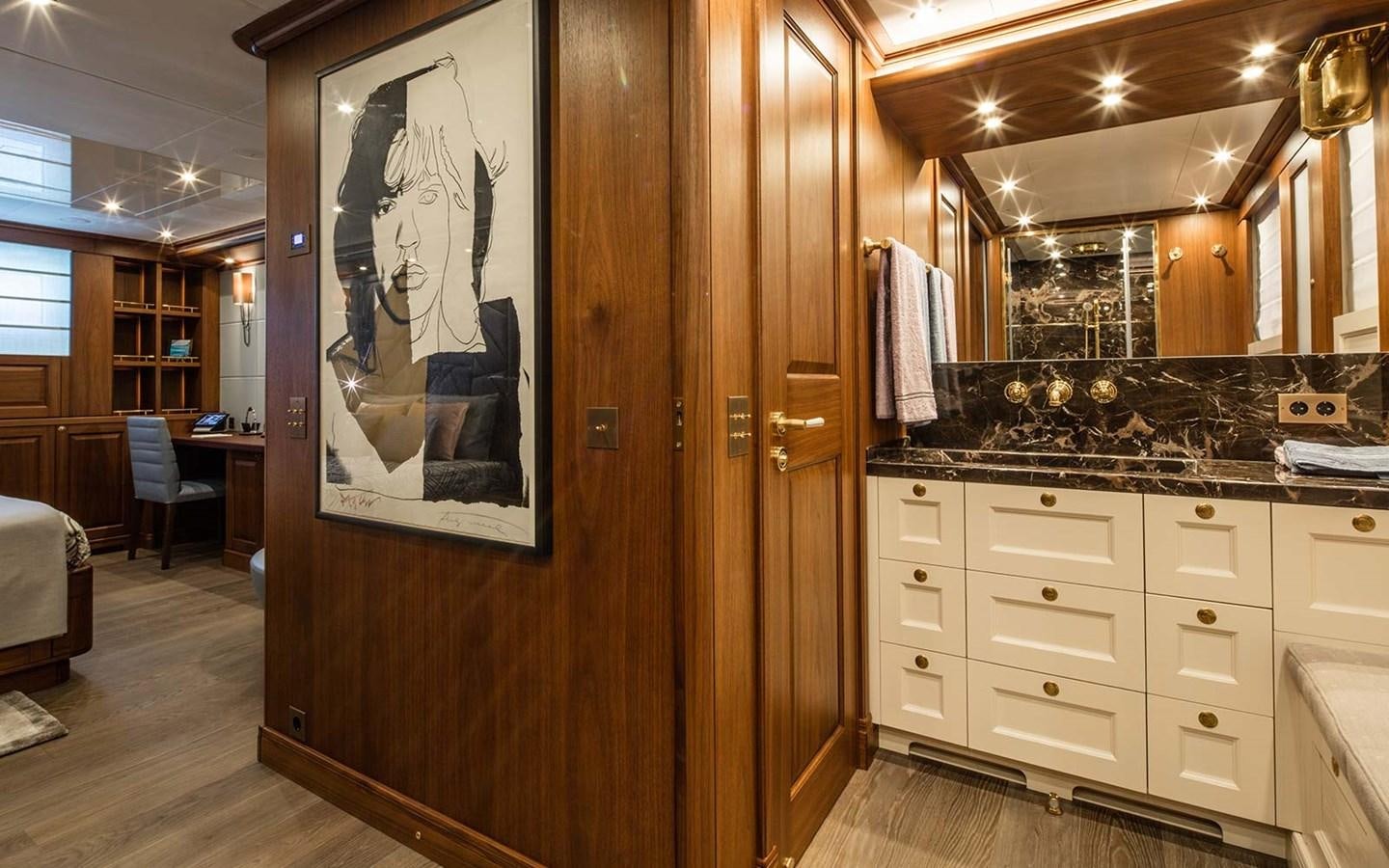 a large bathroom with a large mirror aboard ATLAS Yacht for Sale