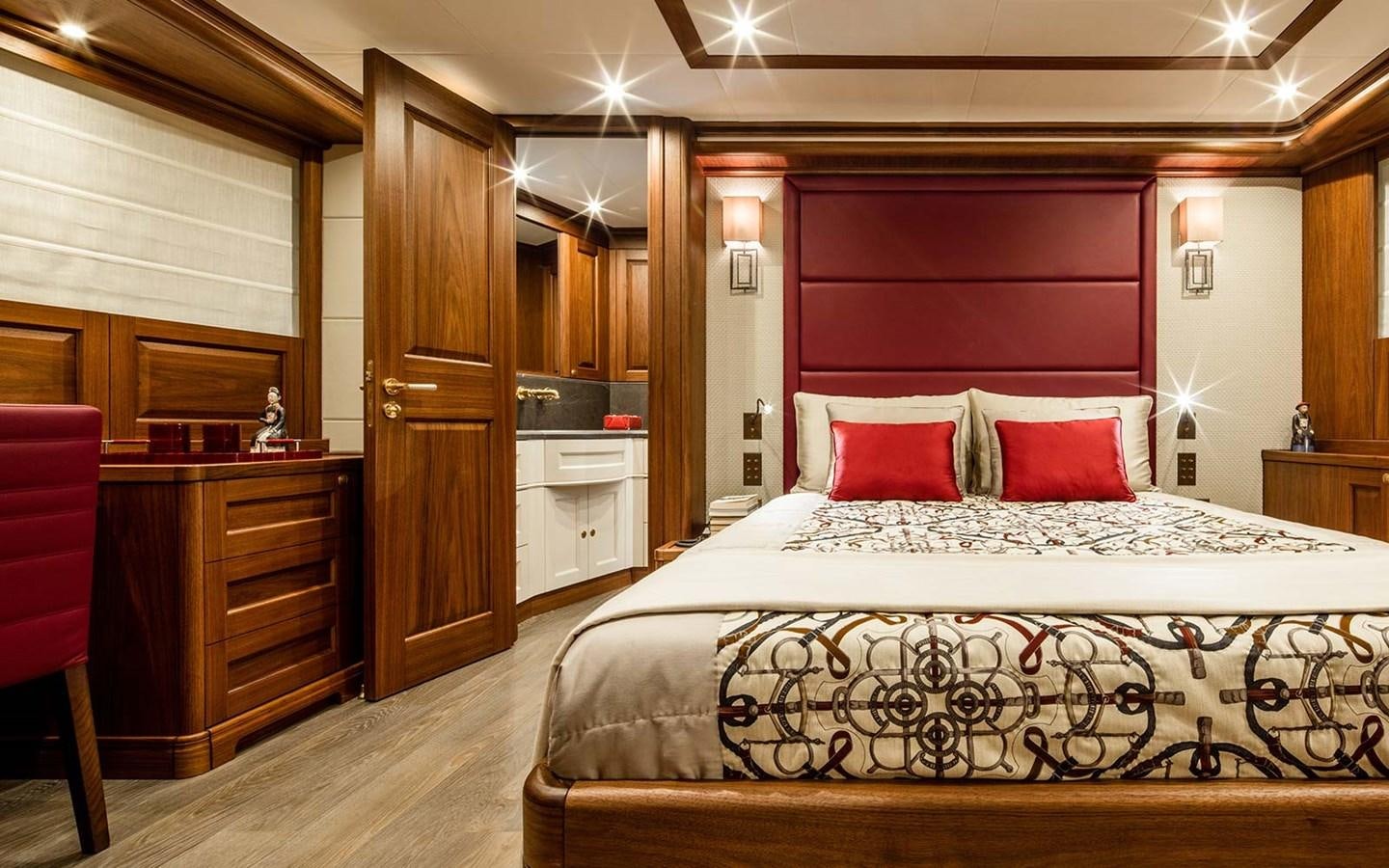 a large bed in a room aboard ATLAS Yacht for Sale
