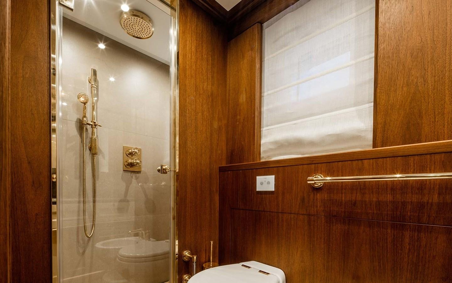a bathroom with a shower and a toilet aboard ATLAS Yacht for Sale