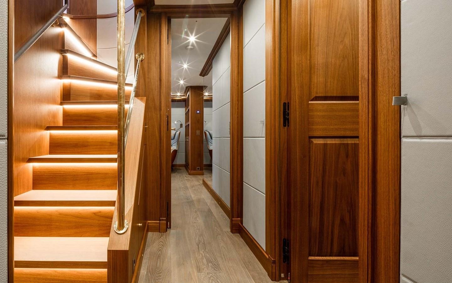 a hallway with wooden doors aboard ATLAS Yacht for Sale