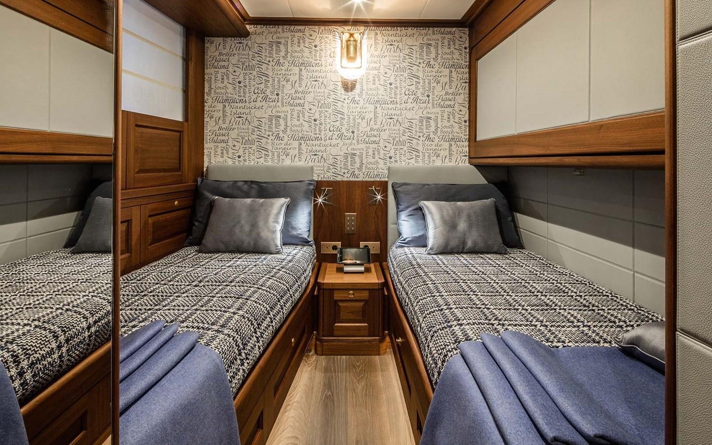a couple of beds in a room aboard ATLAS Yacht for Sale