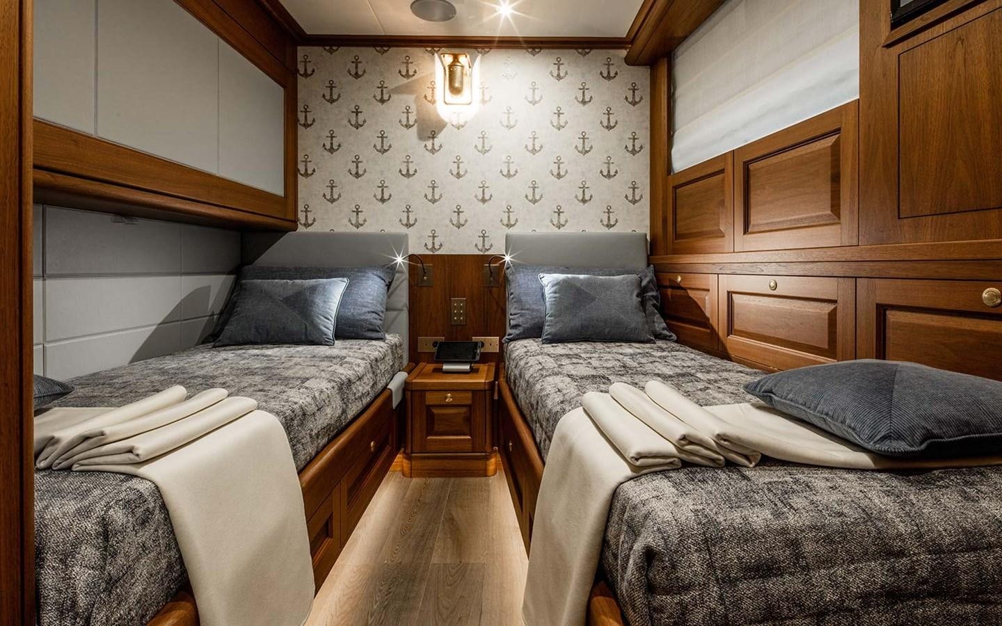a room with two beds aboard ATLAS Yacht for Sale