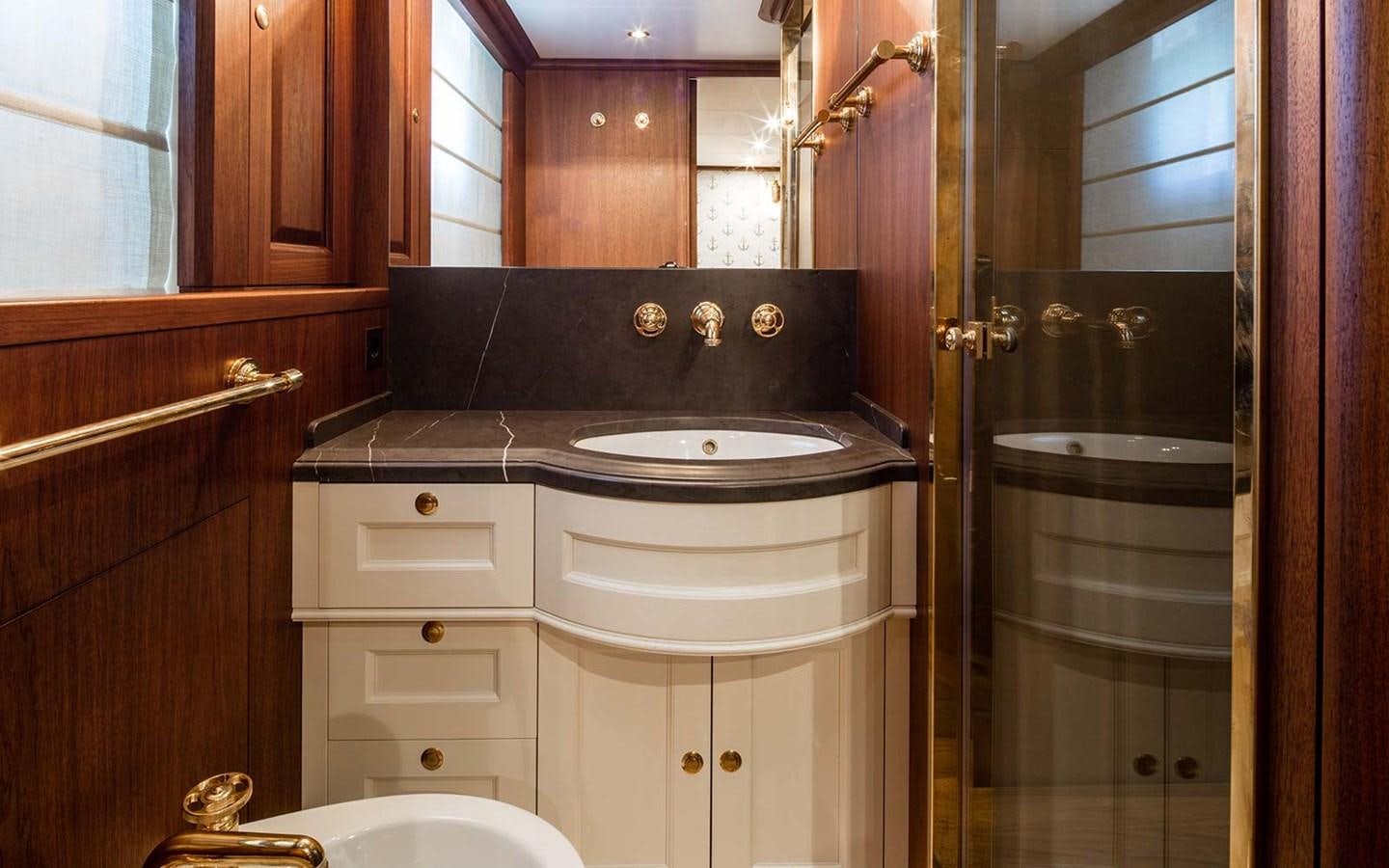 a bathroom with a sink and cabinets aboard ATLAS Yacht for Sale
