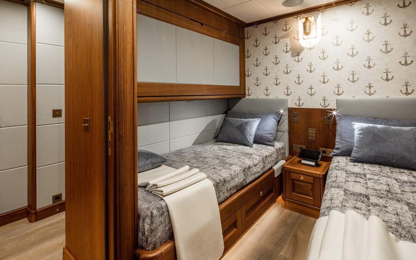 a room with two beds aboard ATLAS Yacht for Sale