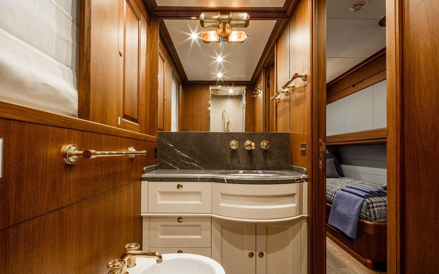 a bathroom with a sink and a mirror aboard ATLAS Yacht for Sale