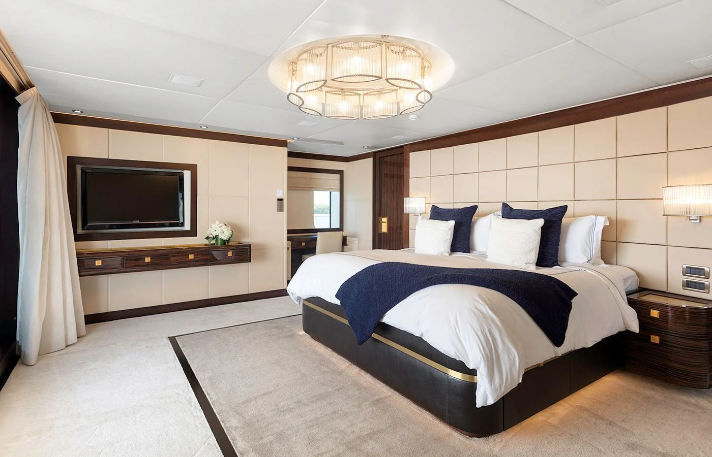 a large bedroom with a large bed aboard MYSTIC Yacht for Charter