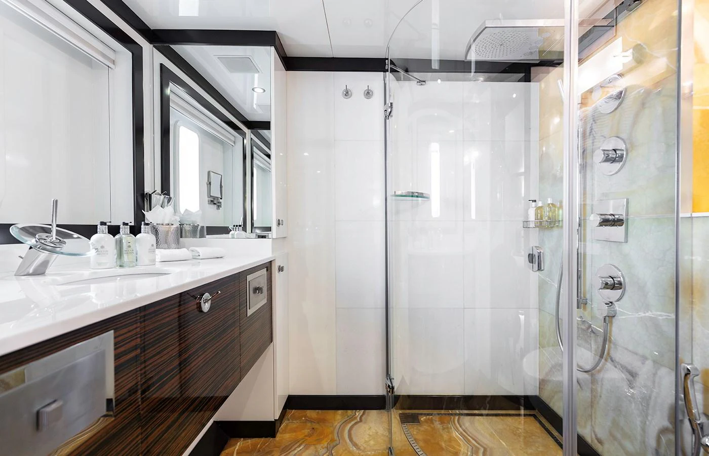 a bathroom with a glass shower aboard MYSTIC Yacht for Charter