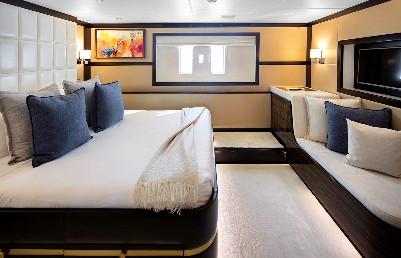 a large living room with a large bed and a flat screen tv aboard MYSTIC Yacht for Charter