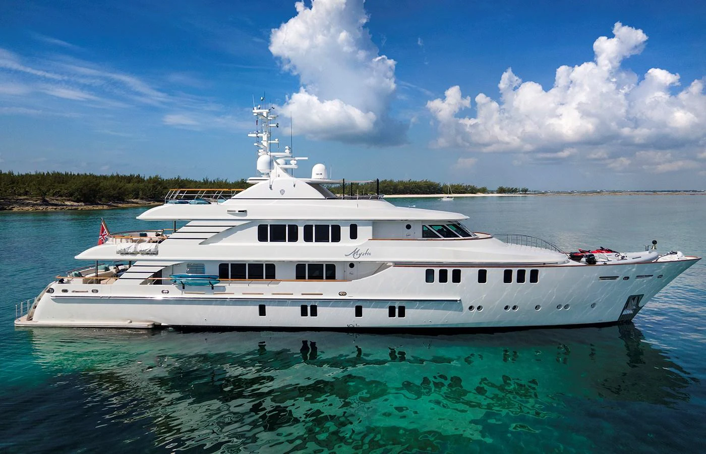 a large white yacht in the water aboard MYSTIC Yacht for Charter