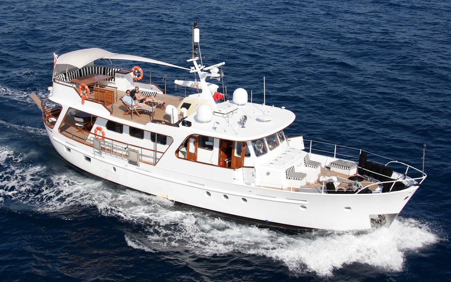 a white boat on the water aboard LACROMA Yacht for Sale