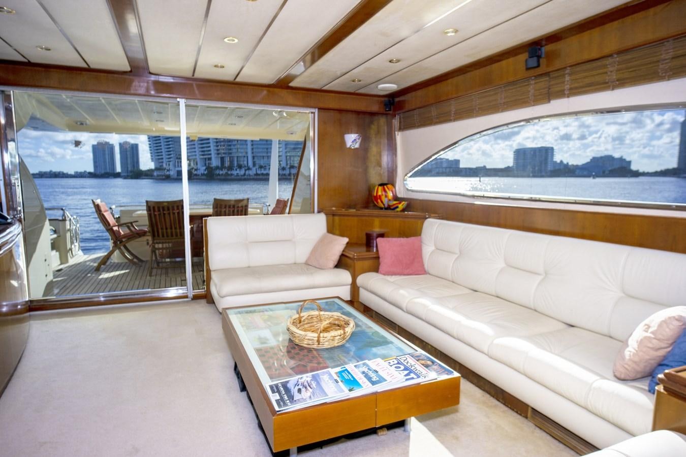 a living room with a large window aboard KARTESSA III Yacht for Sale