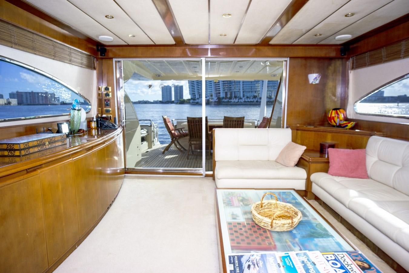 a living room with a large window aboard KARTESSA III Yacht for Sale