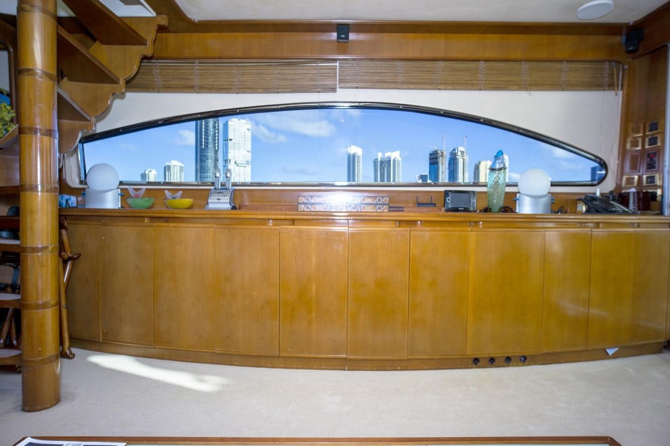 a kitchen with a large window aboard KARTESSA III Yacht for Sale