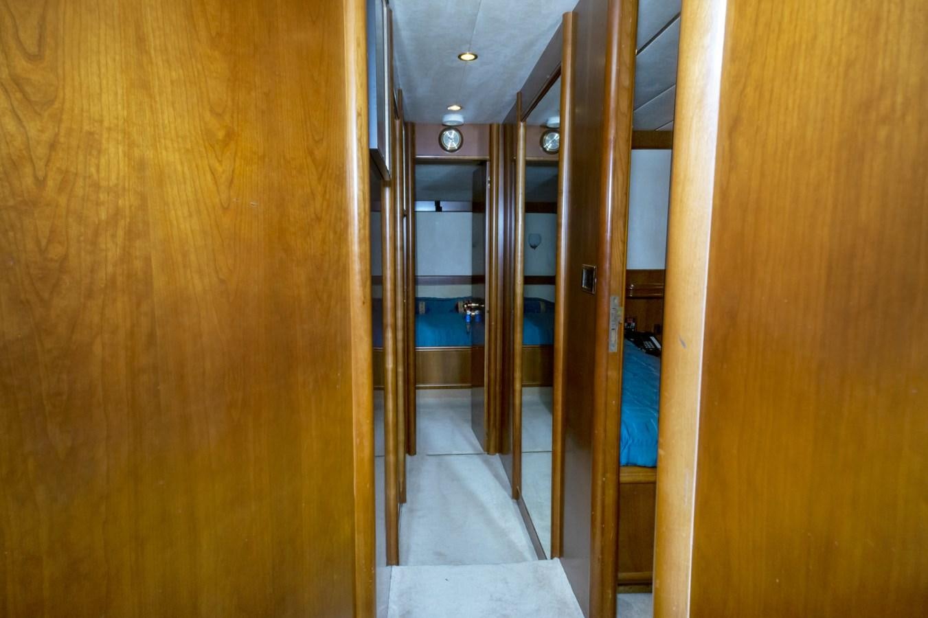 a room with wooden walls and wood floors aboard KARTESSA III Yacht for Sale