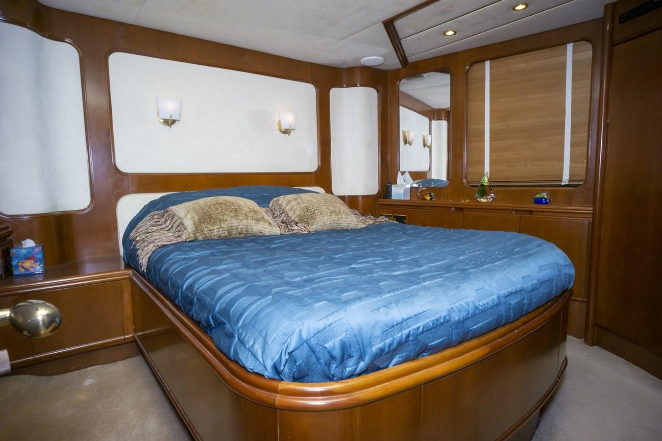 a bed in a room aboard KARTESSA III Yacht for Sale