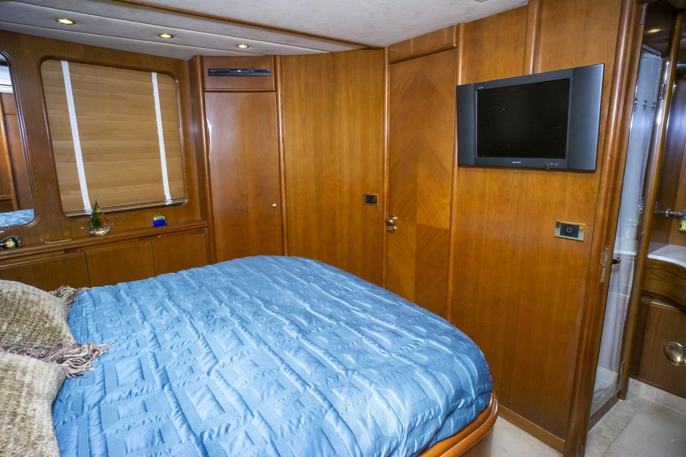 a bed in a room aboard KARTESSA III Yacht for Sale