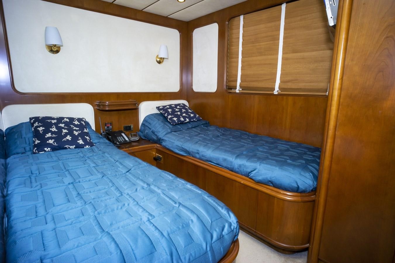 a couple of beds in a room aboard KARTESSA III Yacht for Sale