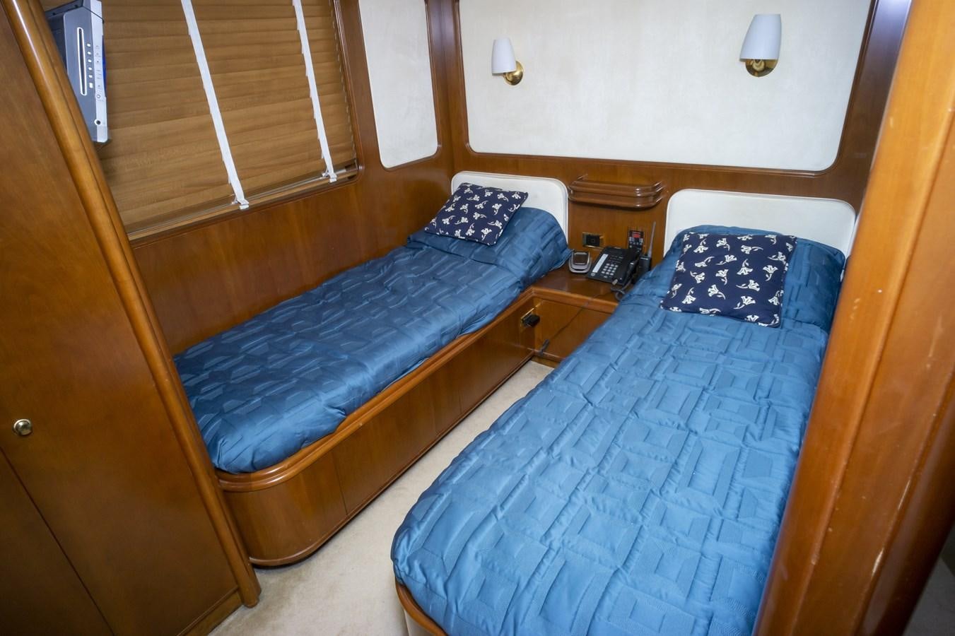 a couple of beds in a room aboard KARTESSA III Yacht for Sale