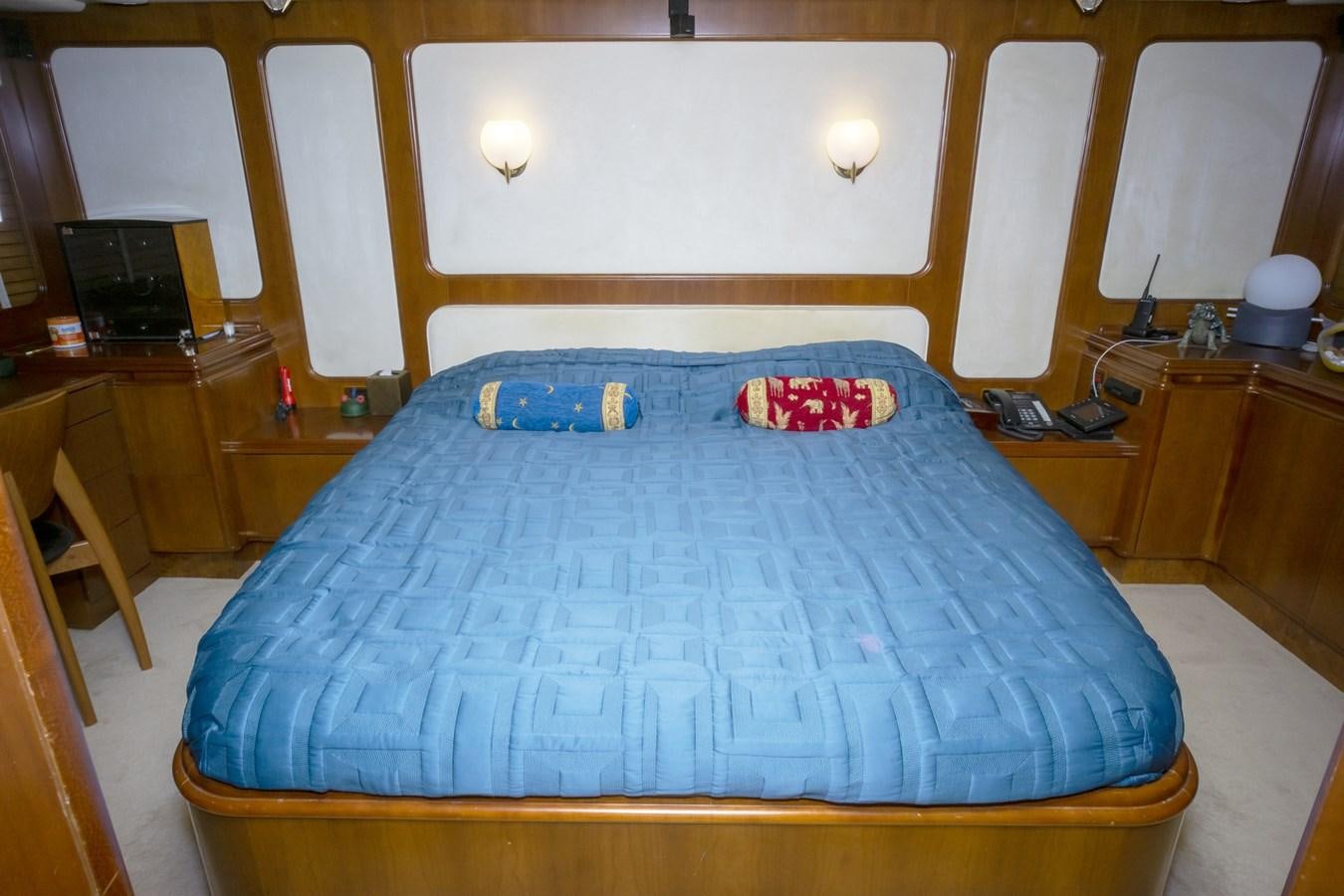 a bed in a room aboard KARTESSA III Yacht for Sale