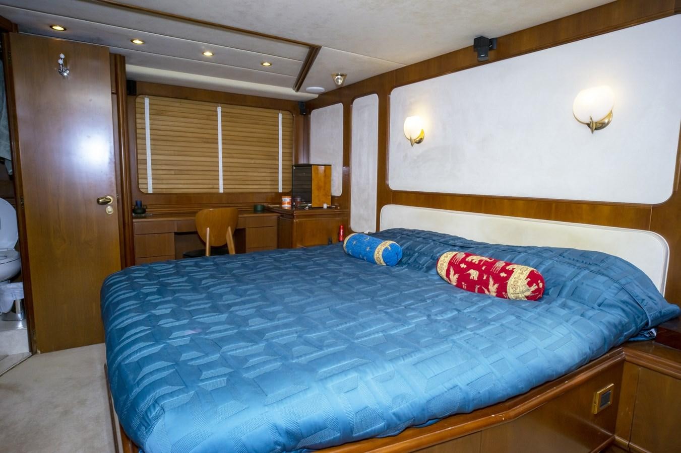 a bed in a room aboard KARTESSA III Yacht for Sale