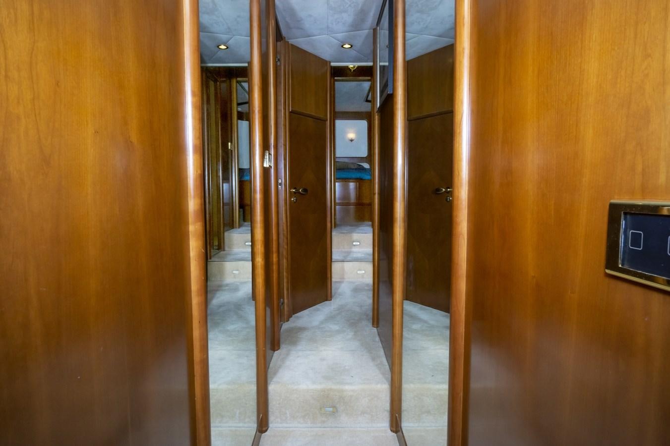 a hallway with wood walls aboard KARTESSA III Yacht for Sale