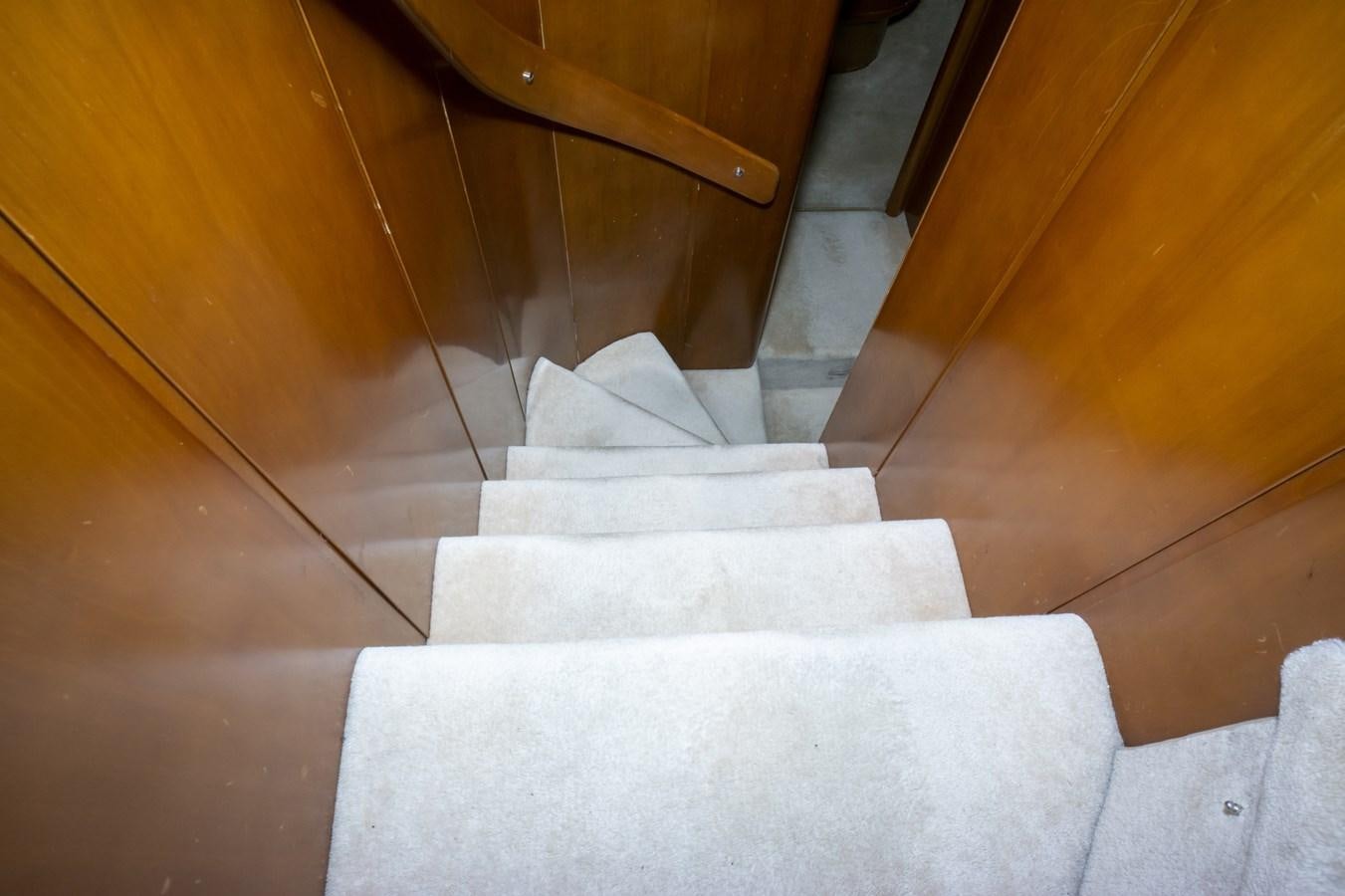 a set of white stairs aboard KARTESSA III Yacht for Sale