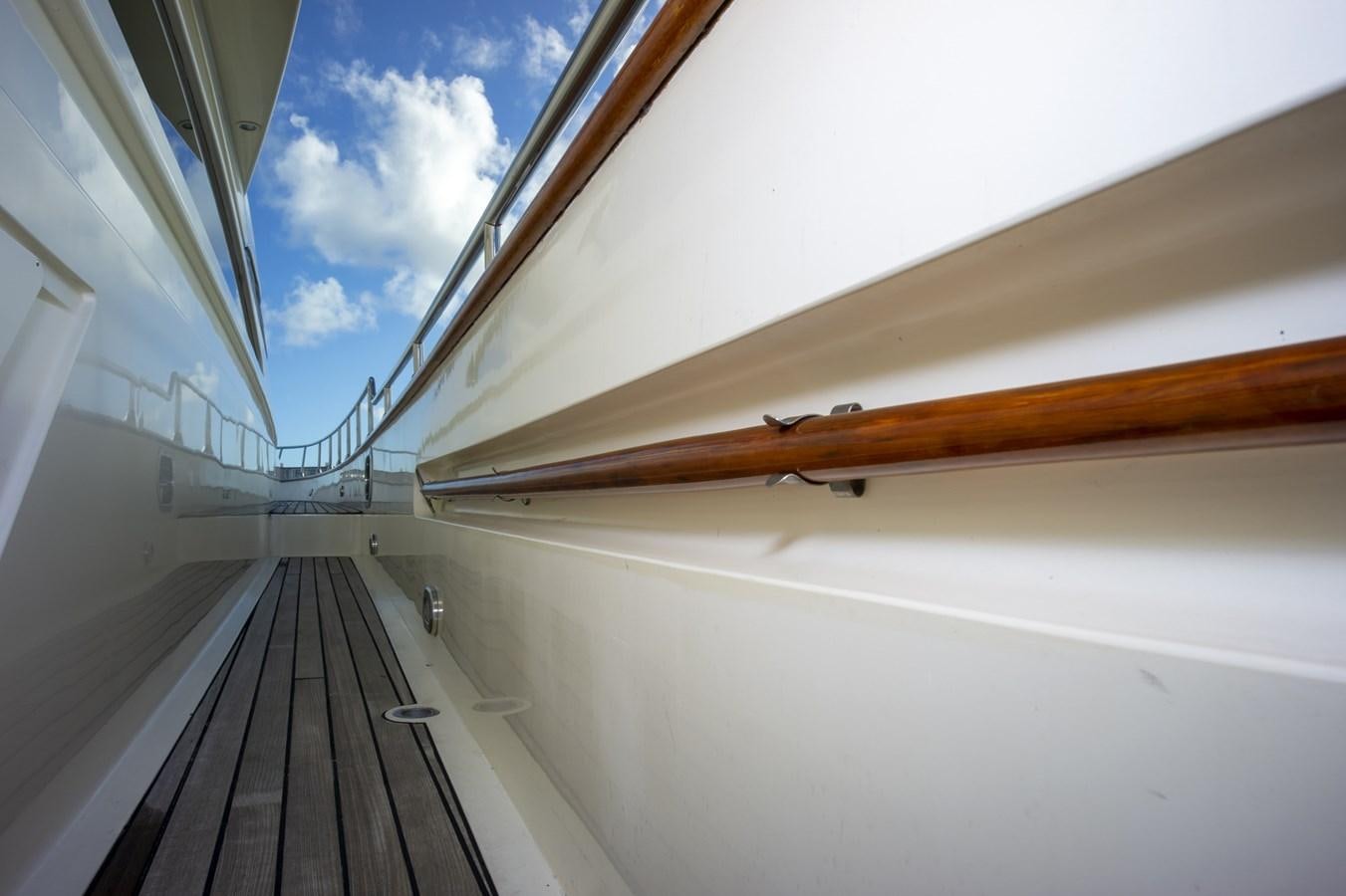 a wooden bridge over water aboard KARTESSA III Yacht for Sale