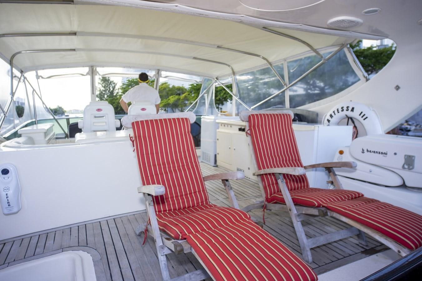a boat with red seats aboard KARTESSA III Yacht for Sale