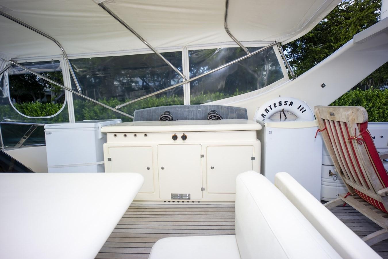 a white car with a red and white roof aboard KARTESSA III Yacht for Sale