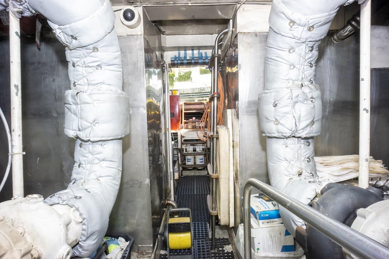 a room with white pipes aboard KARTESSA III Yacht for Sale