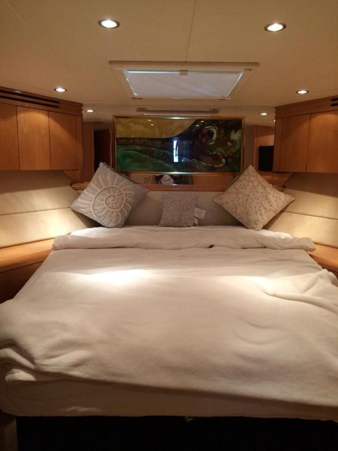 a bed with pillows aboard IN FLIGHT Yacht for Sale