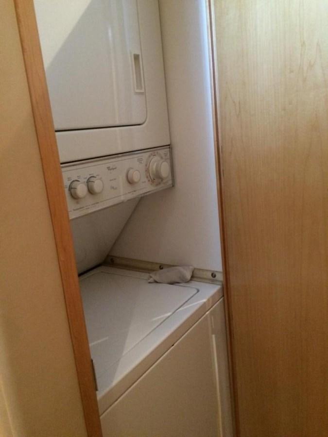a white kitchen with a white microwave aboard IN FLIGHT Yacht for Sale