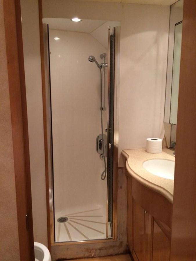 a shower unit in a bathroom aboard IN FLIGHT Yacht for Sale