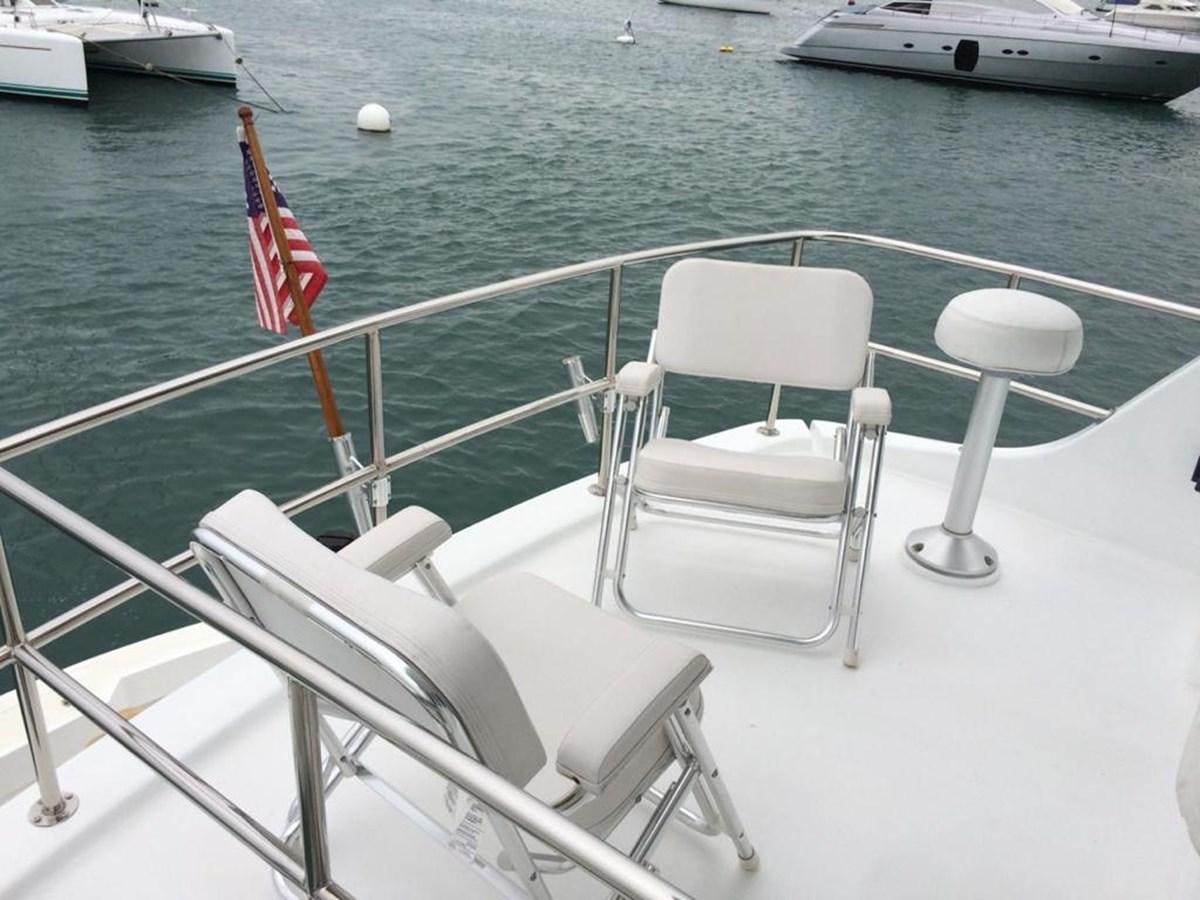 a boat with chairs on it aboard IN FLIGHT Yacht for Sale