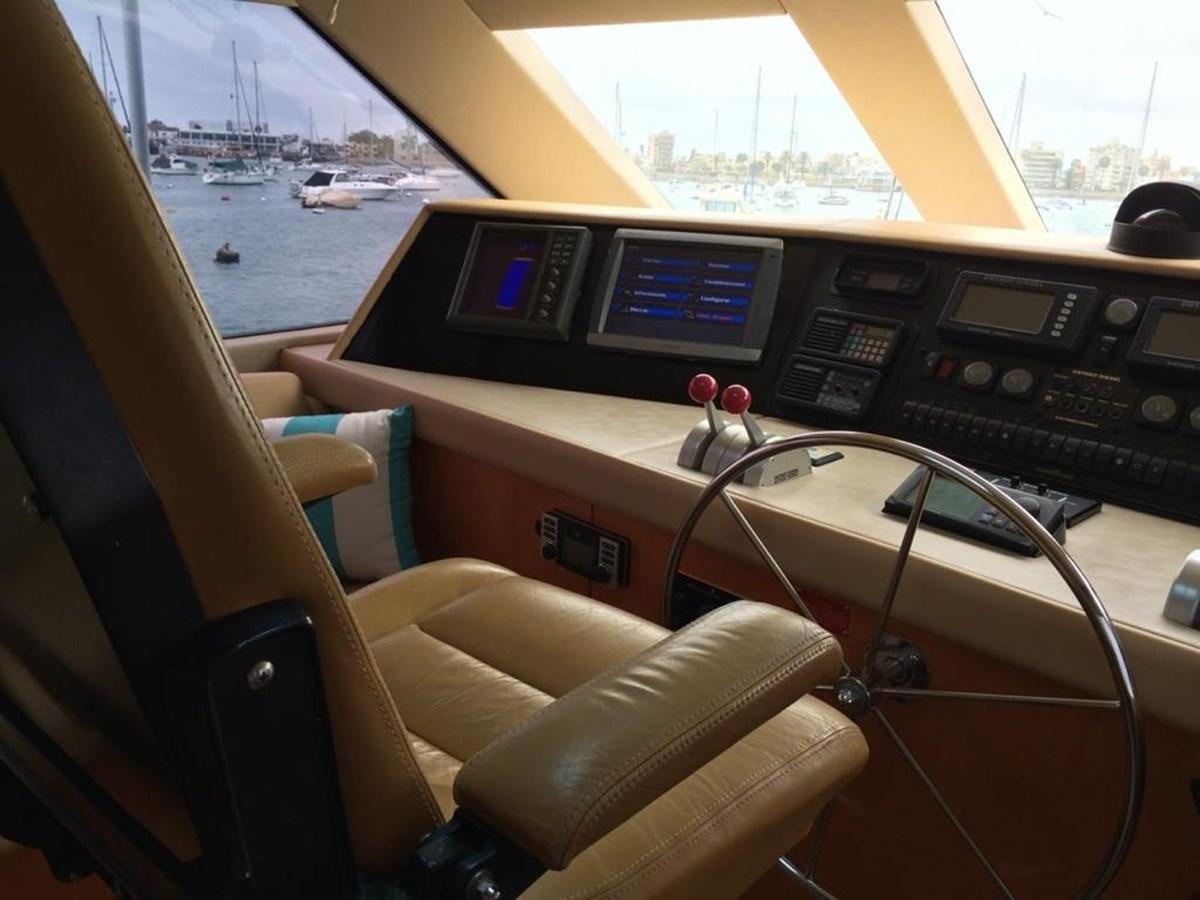 inside of a vehicle with a view of the water and boats aboard IN FLIGHT Yacht for Sale